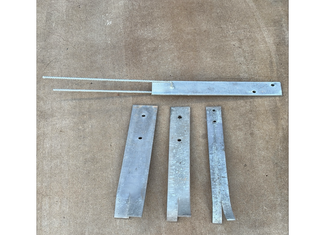 Fish Plates Sitting On A Concrete Surface — Quality Fabrications & Welding Pty Ltd In Bohle, QLD