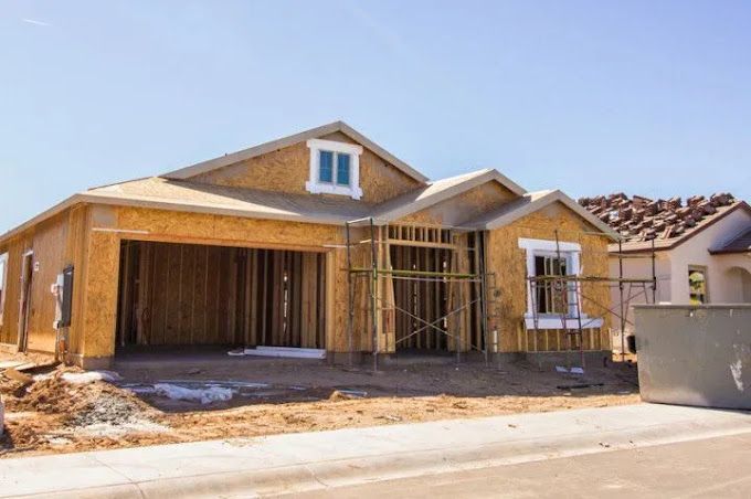 A house is being built in a residential area.