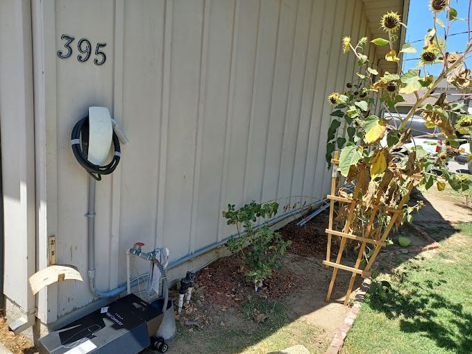 A house with a solar panel on the side of it.