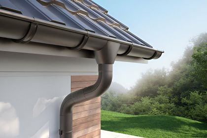 A house with a gutter on the side of it.