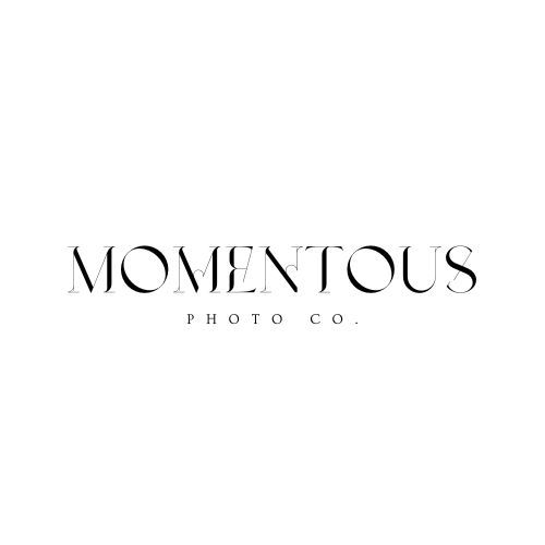 A black and white logo for a photo company called momentous photo co.