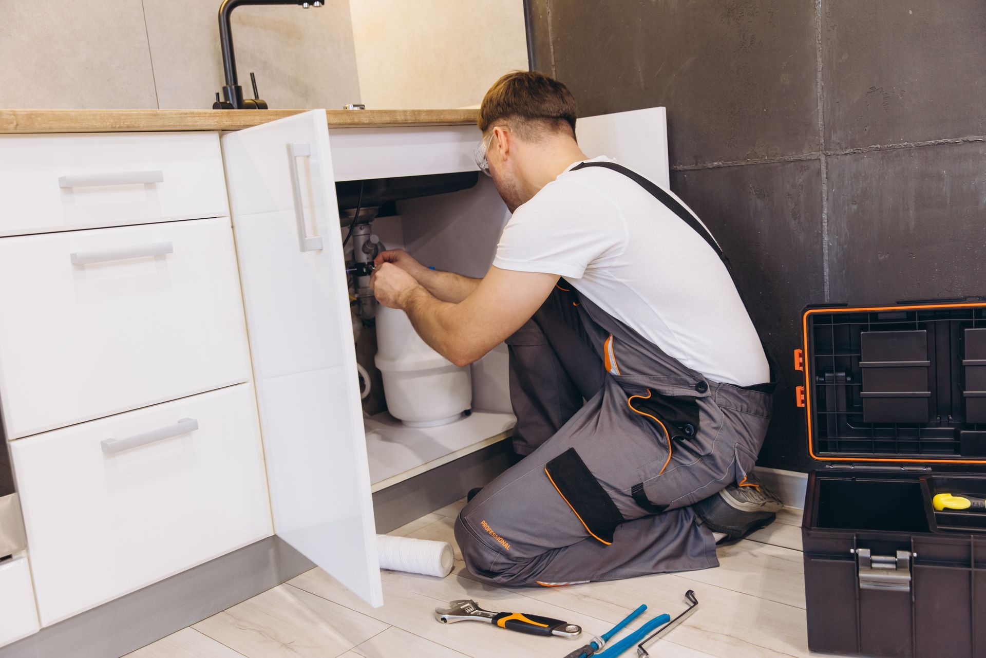 A professional technician installing a new unit for reliable home water softener replacement