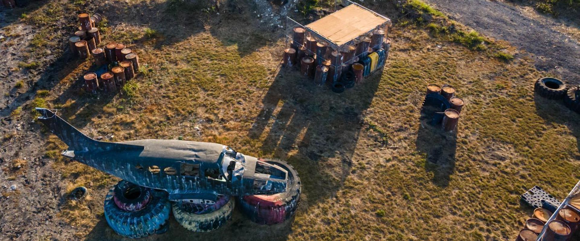 A group of people are playing paintball on a field.