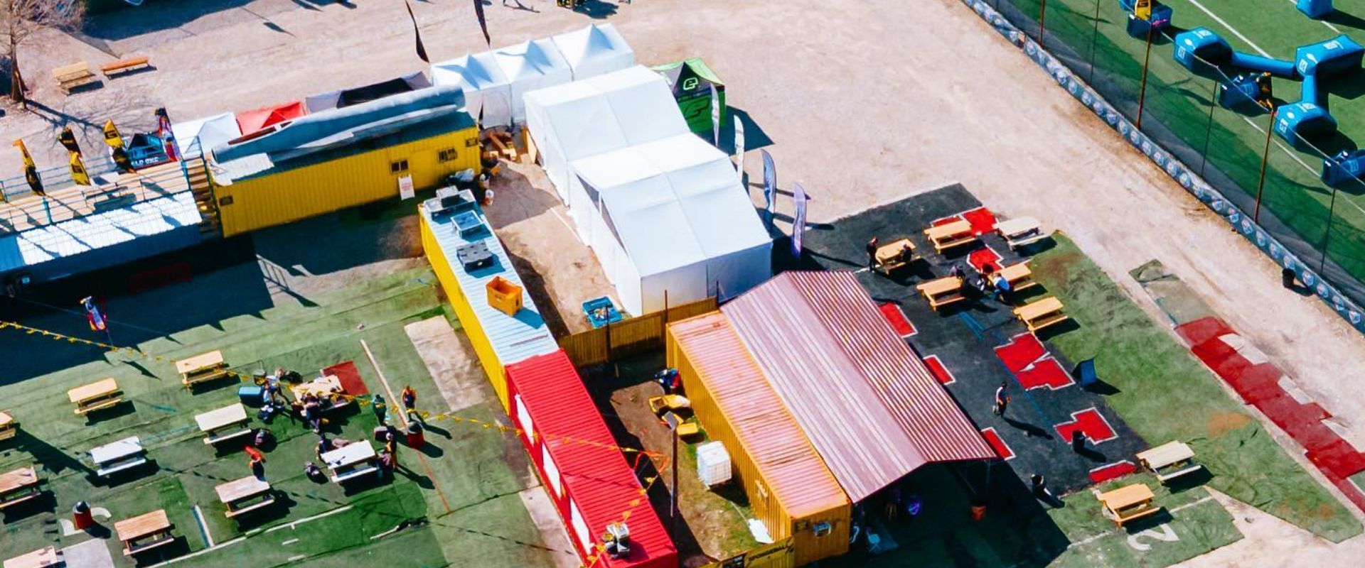 A man in a seattle seahawks jersey is standing in front of a crowd of people.