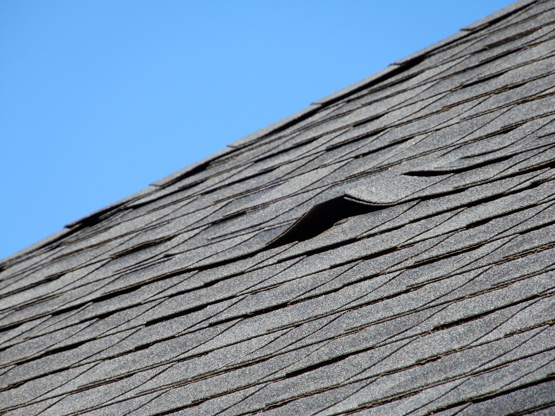 A close up of a roof with a hole in it.