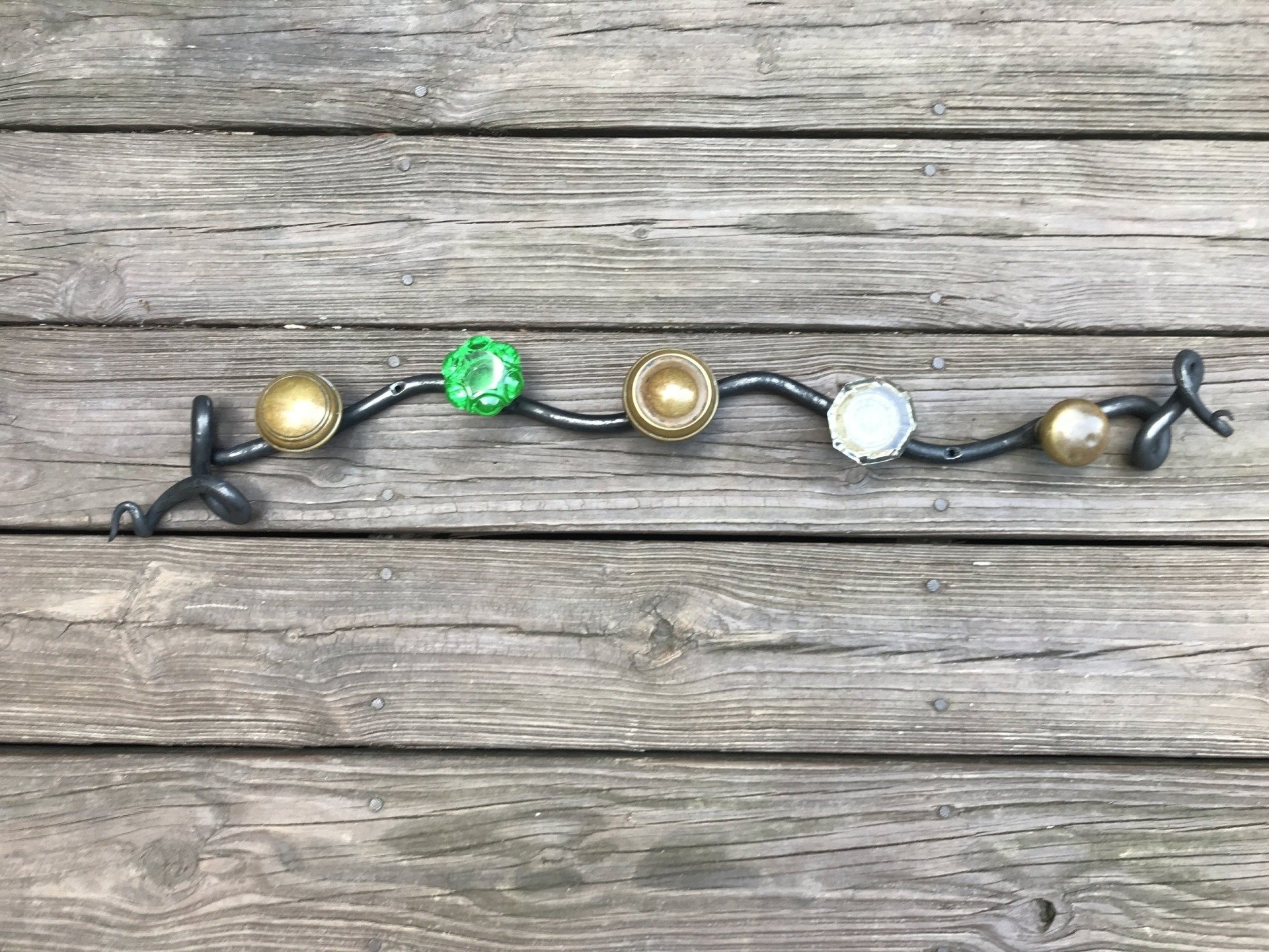 A string of christmas lights is sitting on a wooden table.