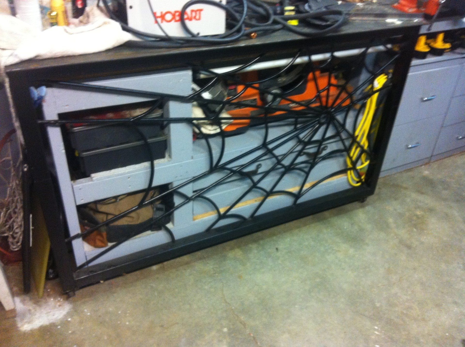 A workbench with a spider web design on it