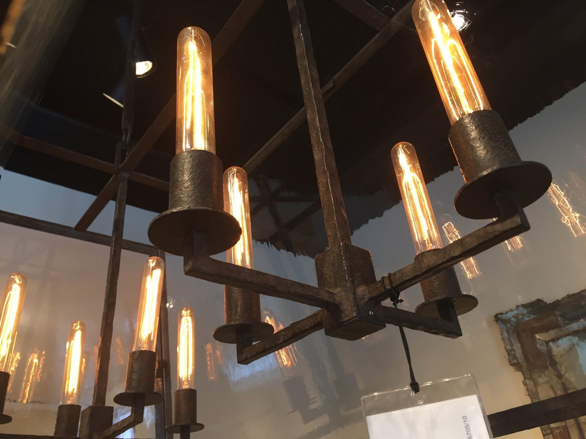 A chandelier with many lights hanging from the ceiling