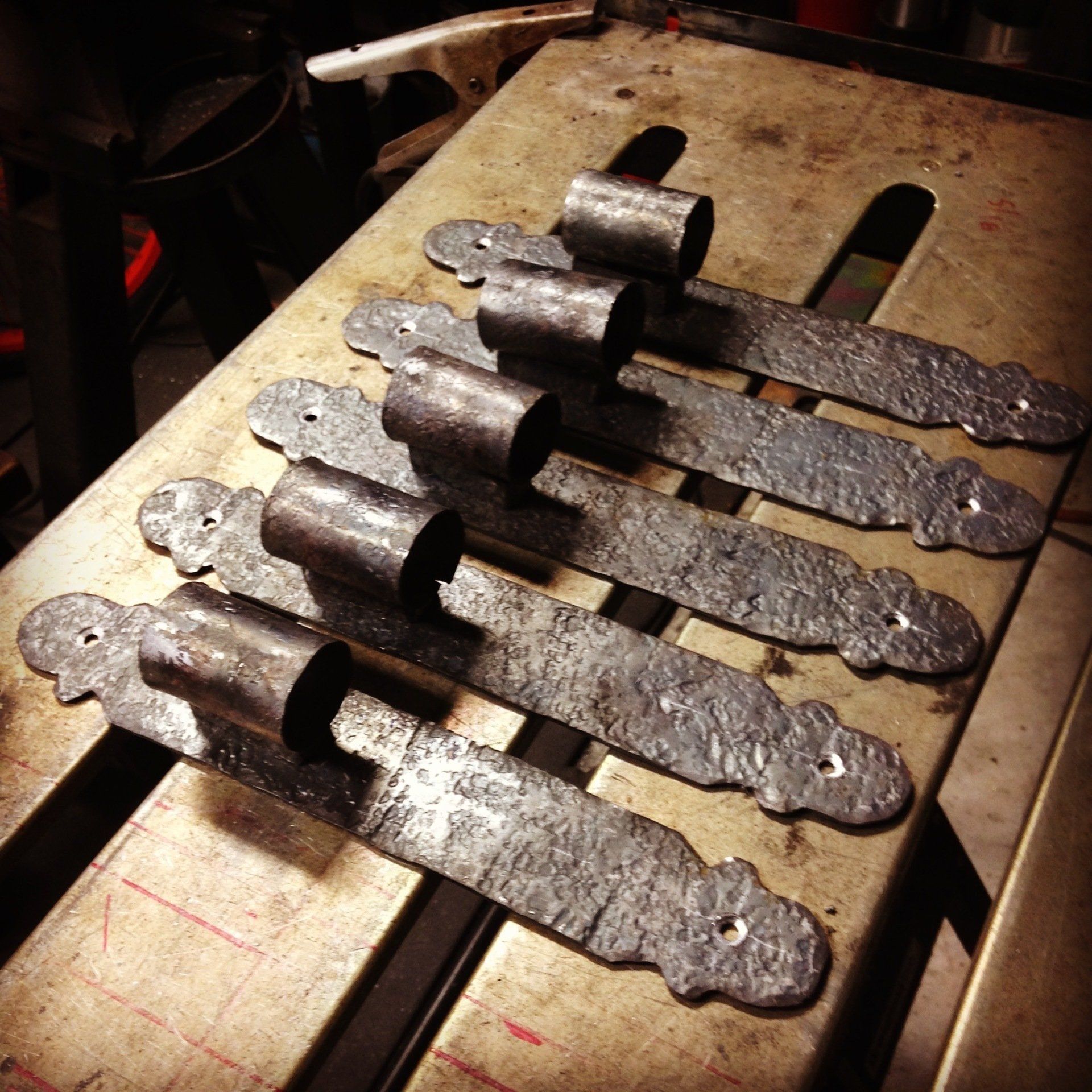 A bunch of metal pieces are sitting on a table