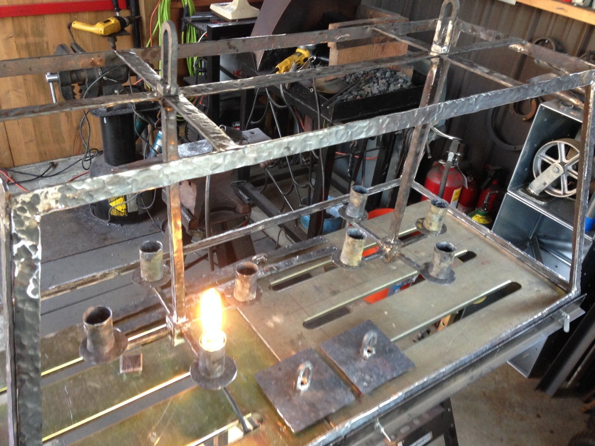 A metal shelf with a light on top of it