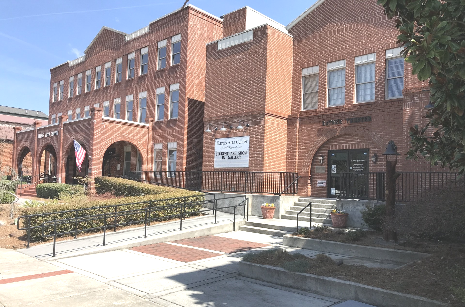 A large brick building with stairs leading up to it