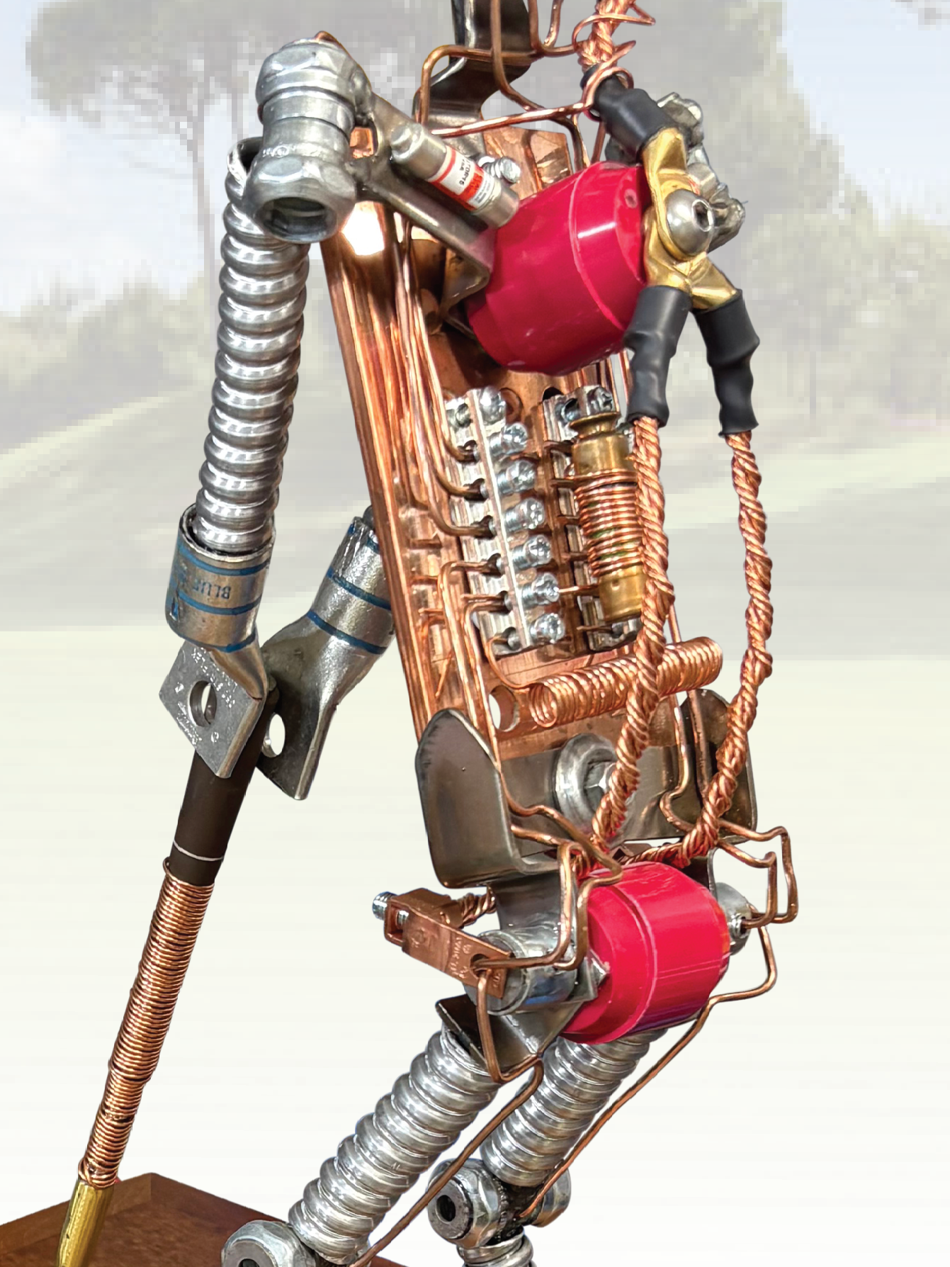 A large white house is surrounded by trees and a lush green lawn.