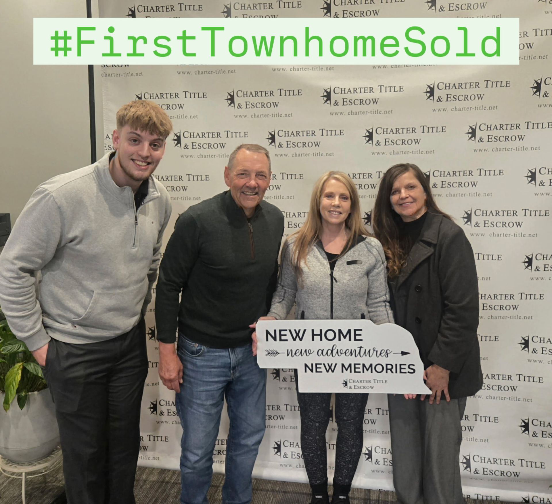 Four people pose with a