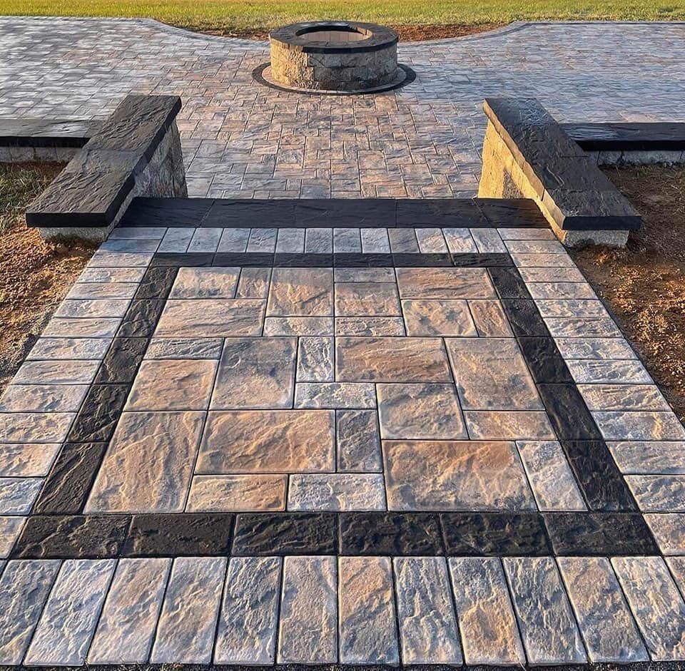 There is a fire pit in the middle of the patio.