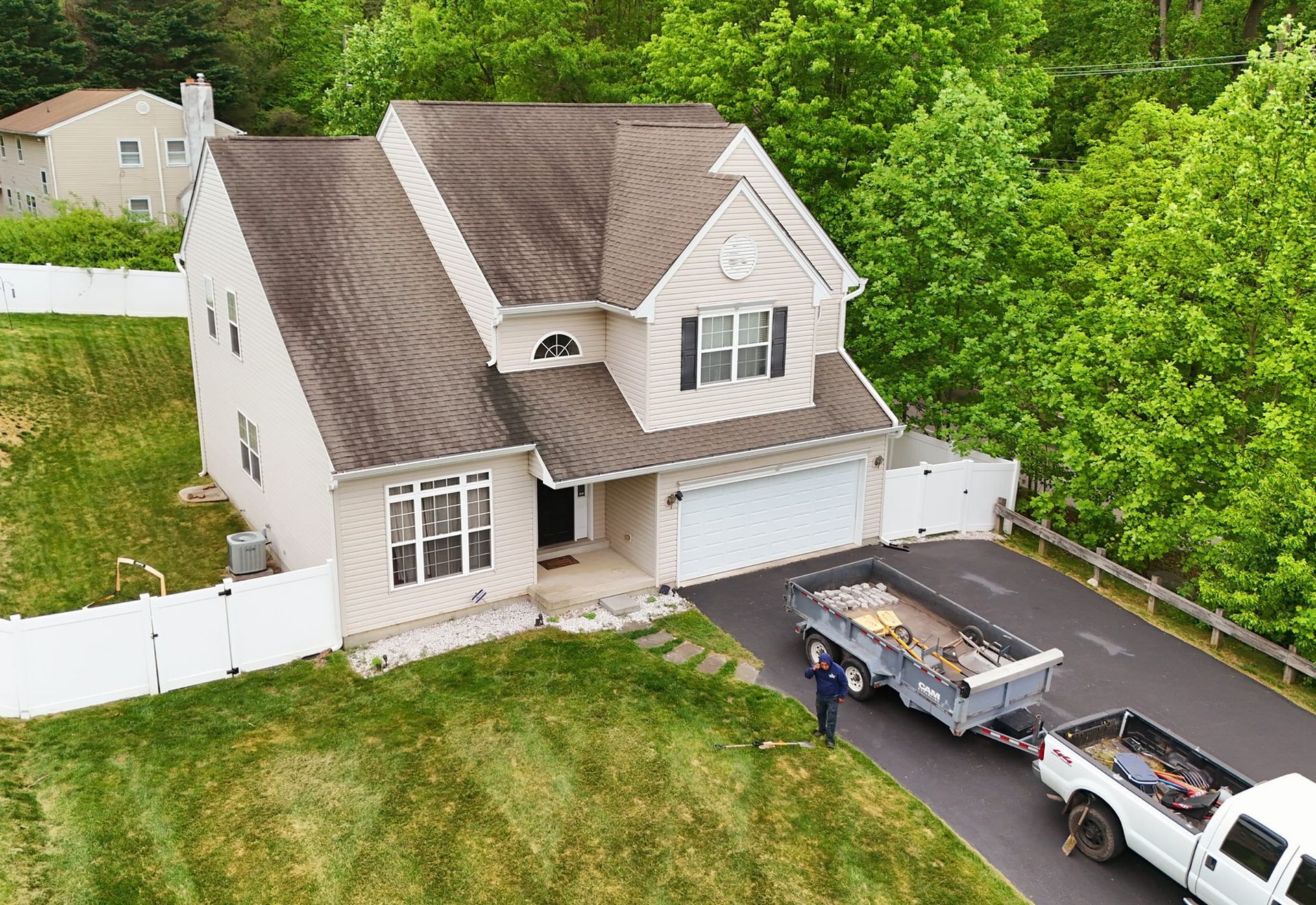 An aerial view of a house with a truck parked in front of it.