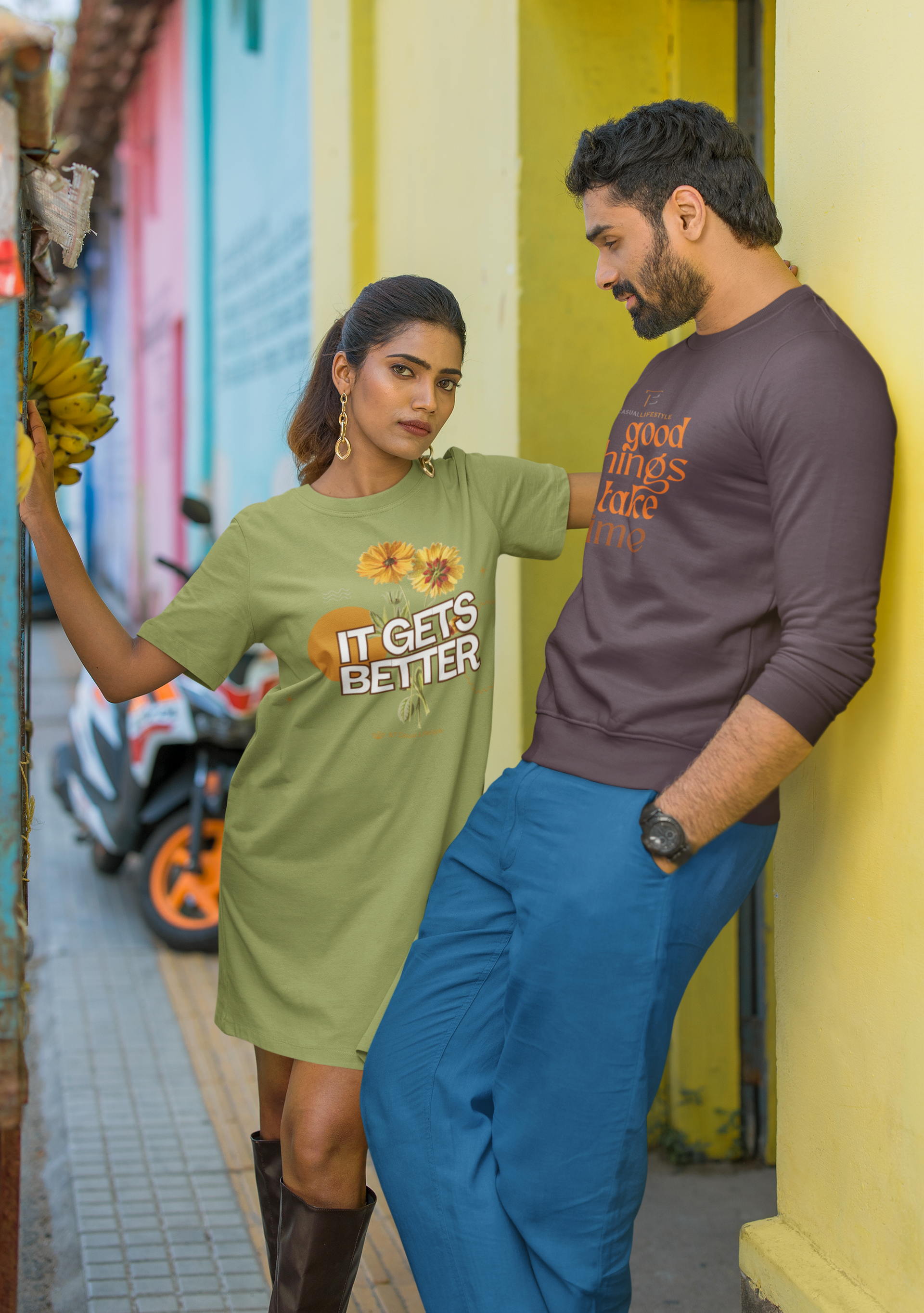 A man and a woman are standing next to each other on a sidewalk.