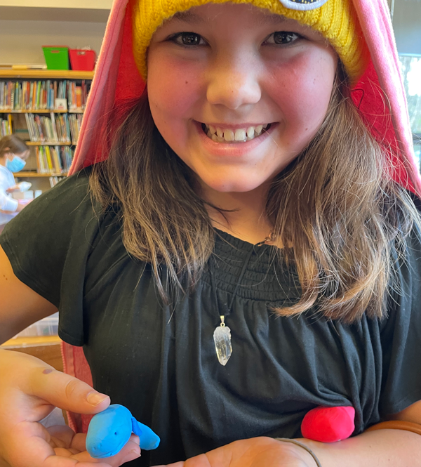 Camper holding a craft