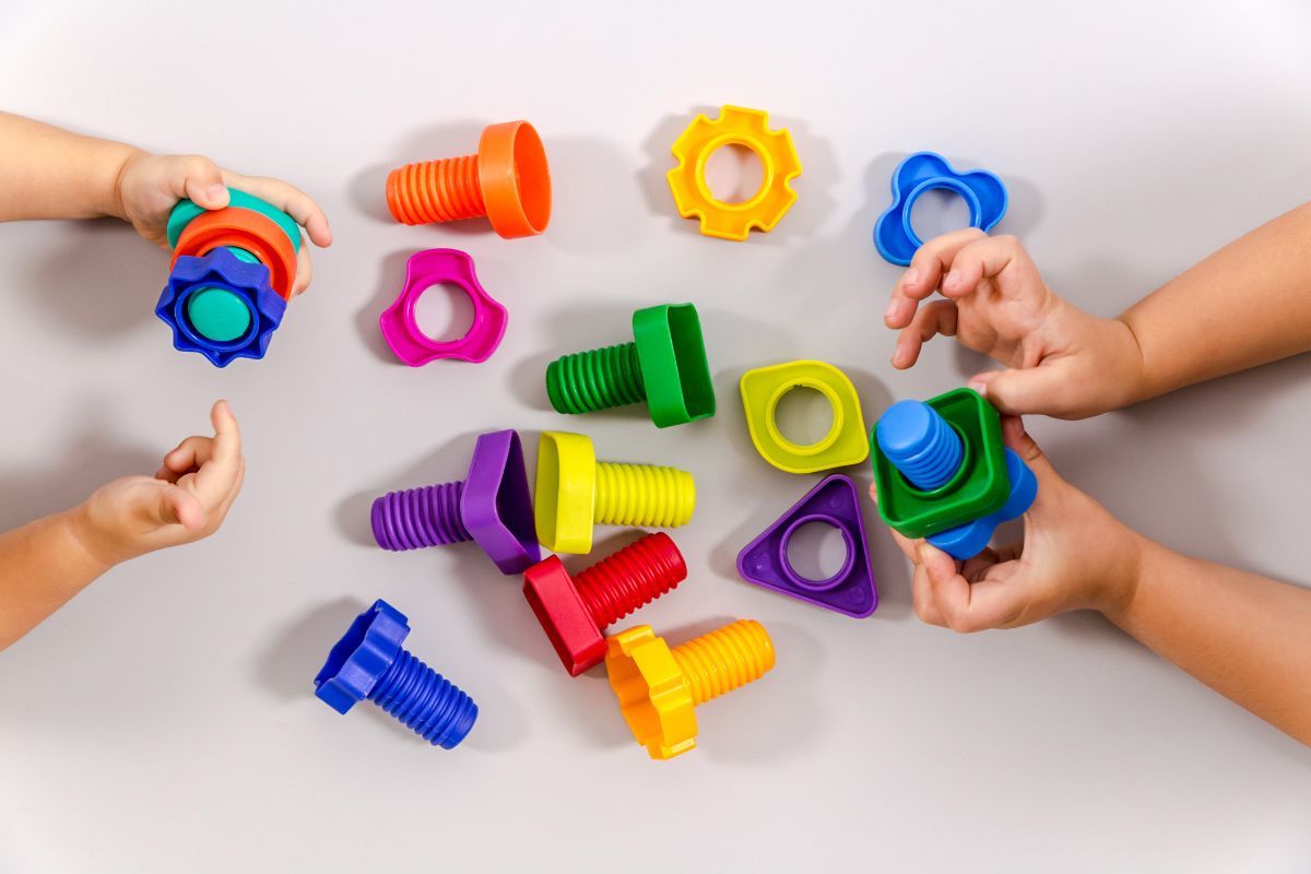 Two Children Playing with Toys — Las Cruces, NM — Discovery Child Development Center