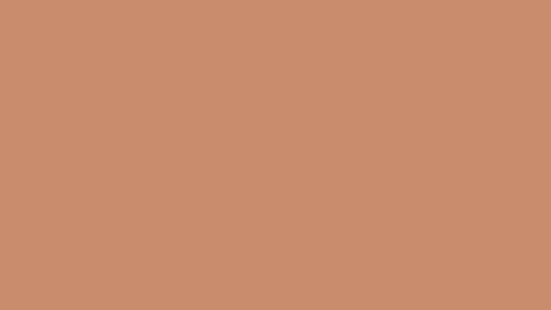 A close up of a plain brown background.