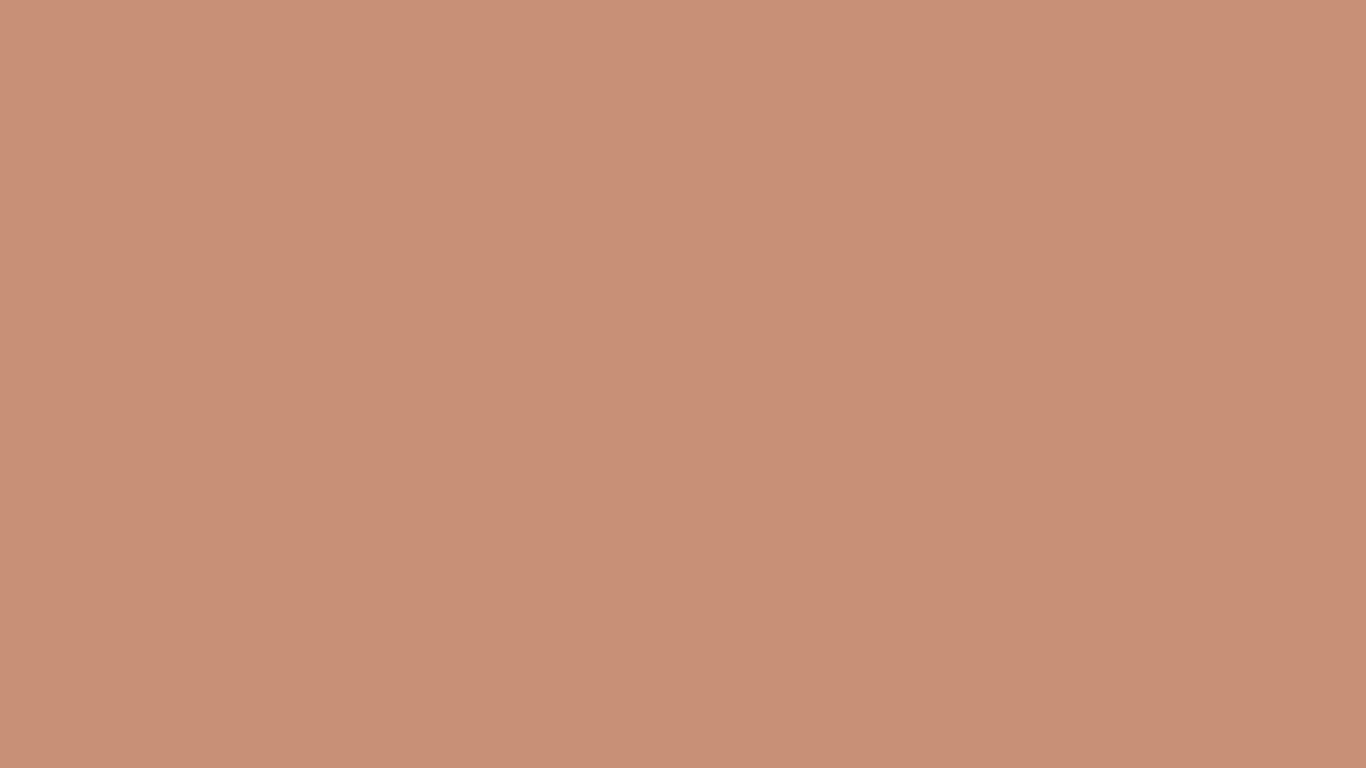 A close up of a plain pink background.
