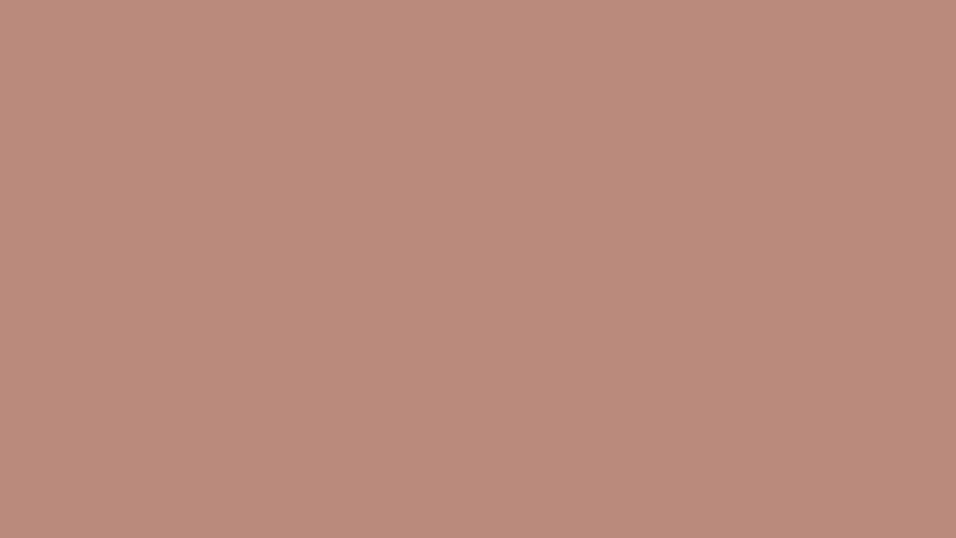 A close up of a pink background with a plain texture.