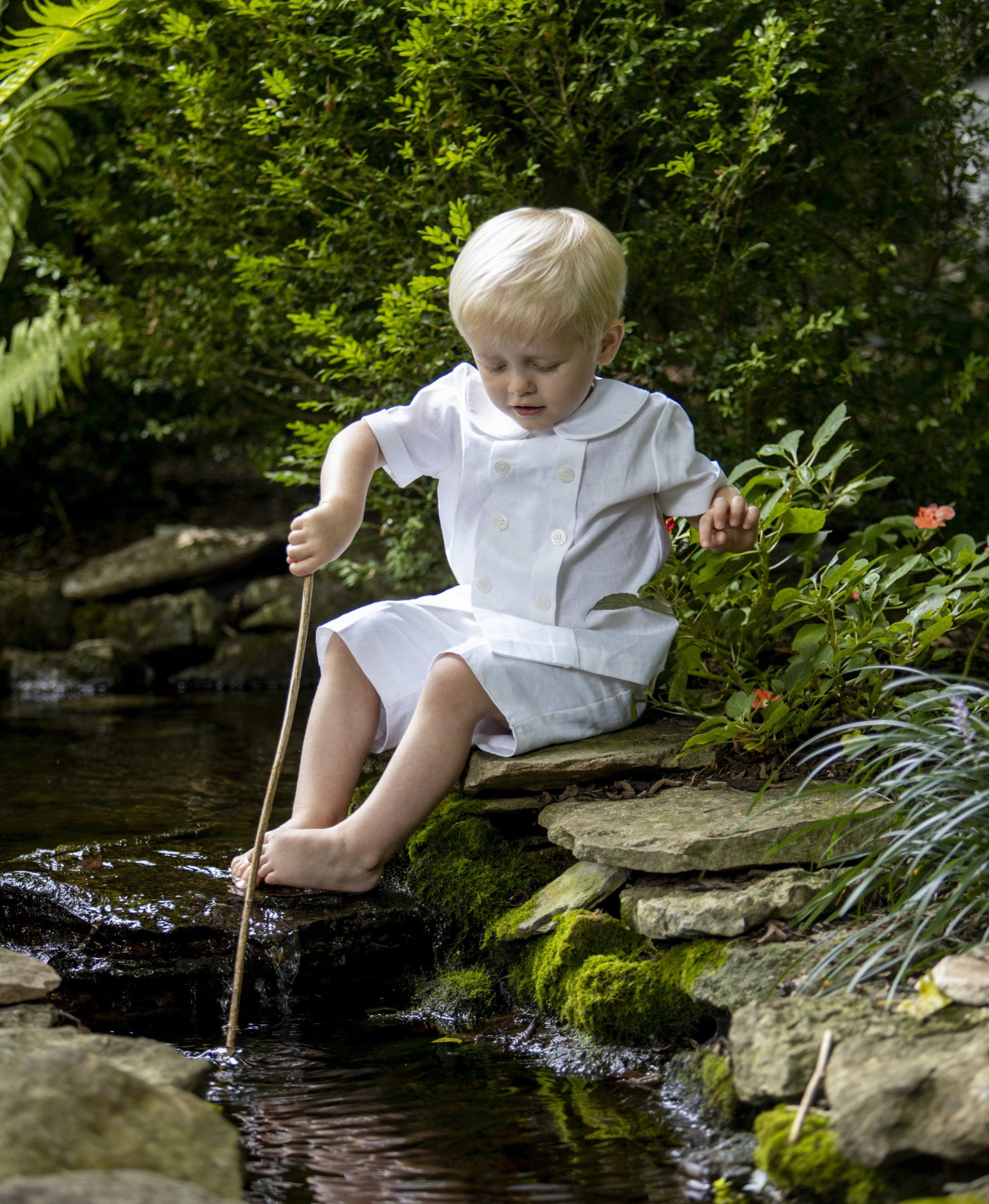 Photo of boy playing in pond in Nashville