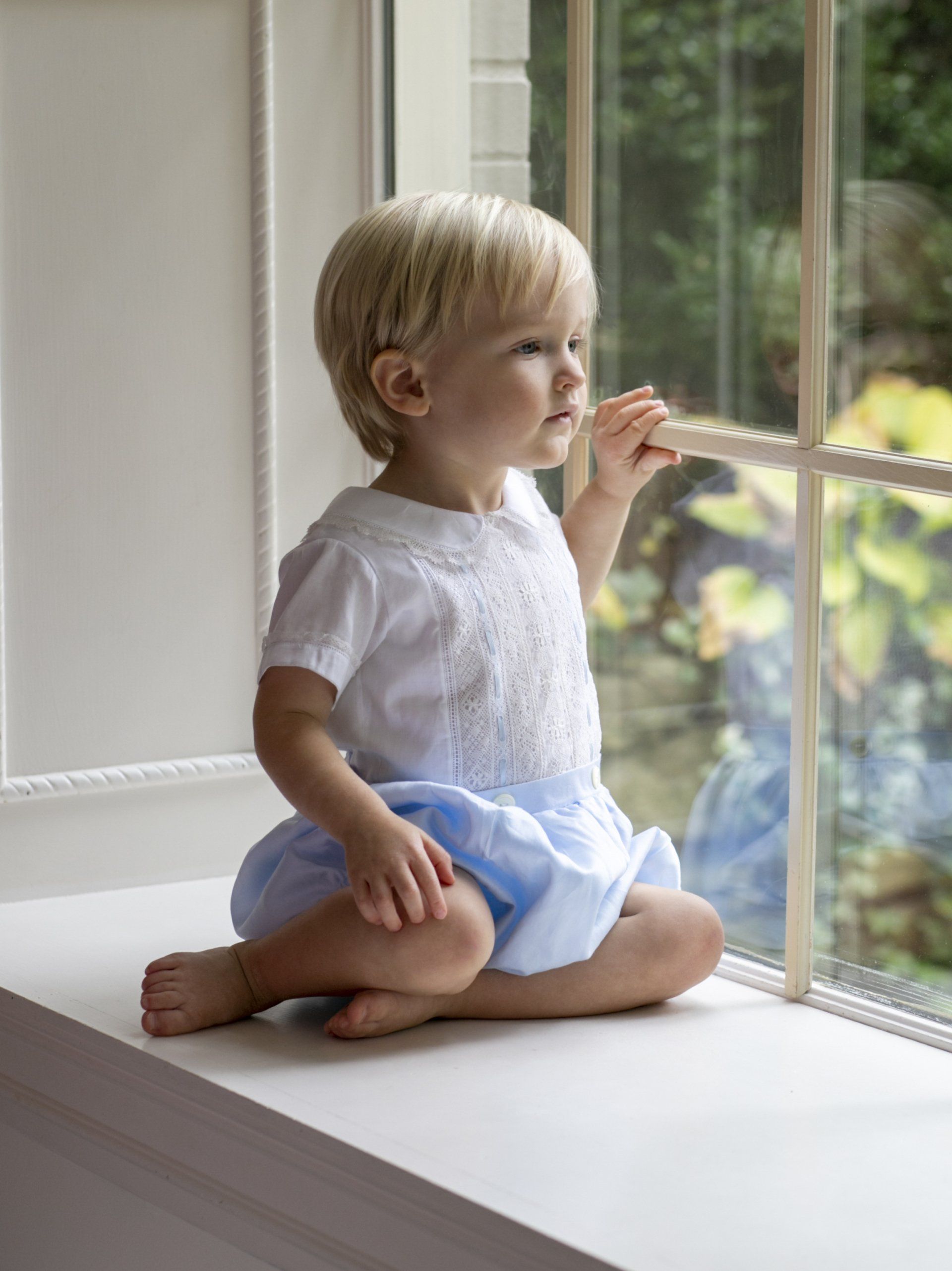Cute photo of child looking out the window