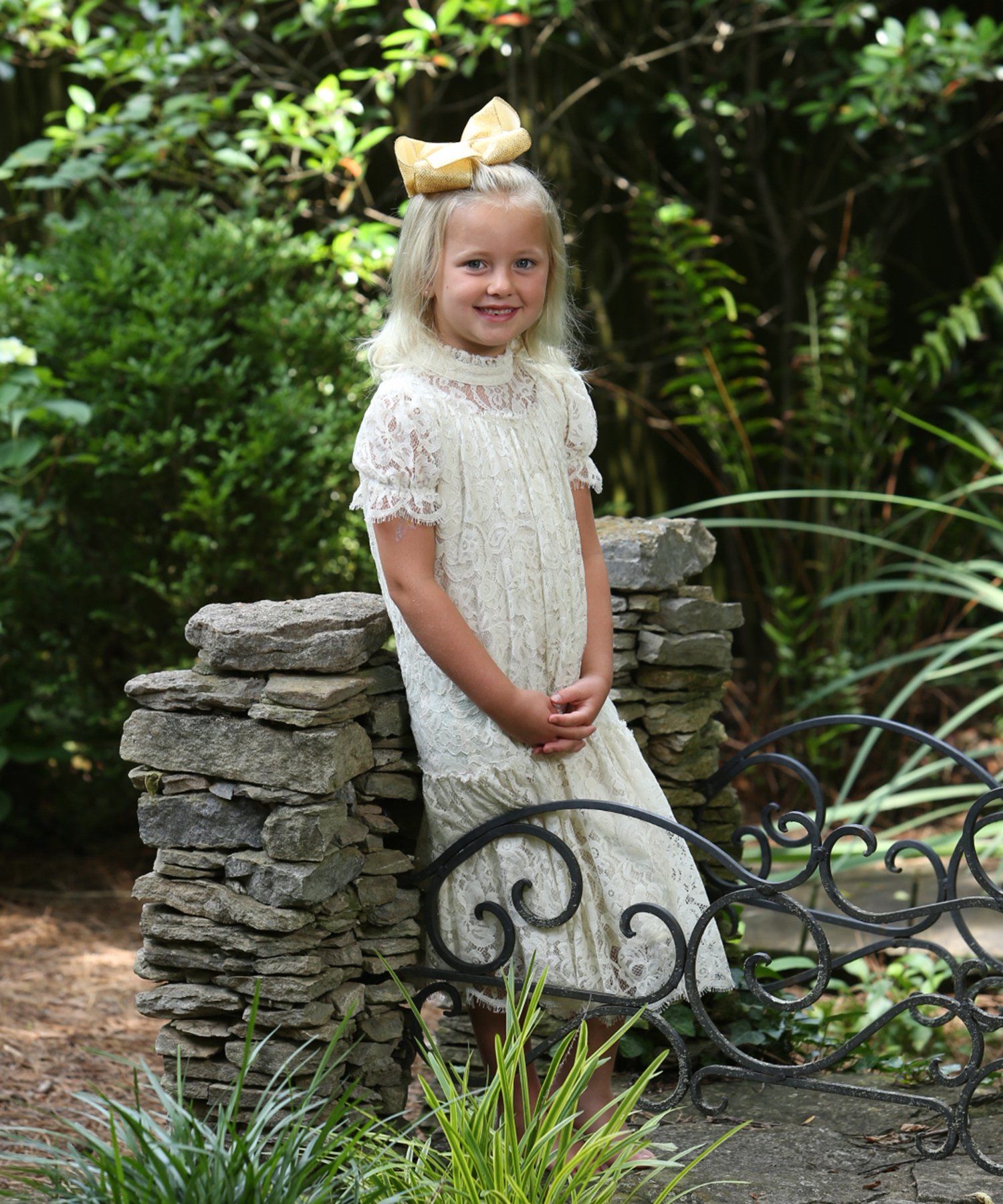 Photo of girl sitting on stone wall outdoors in Nashville