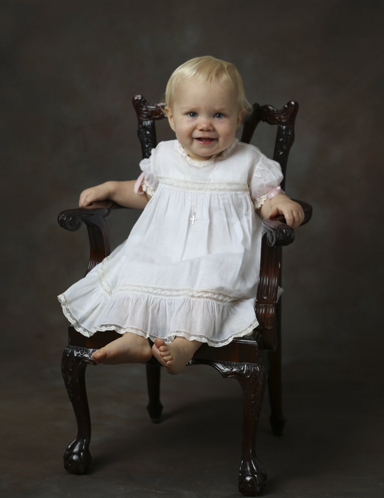 Vintage photo of child sitting in rocking chair