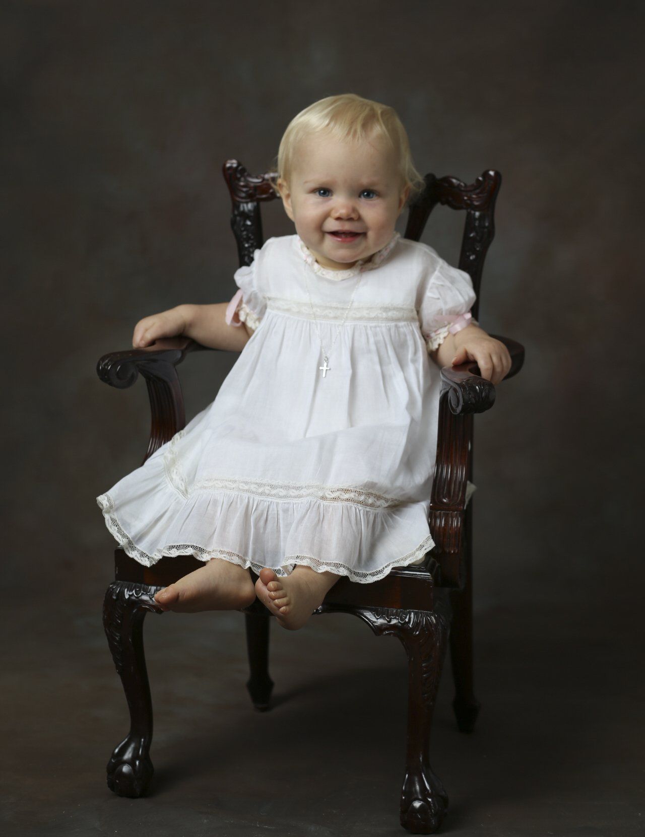 Classic baby portrait in chair by Nashville photographer