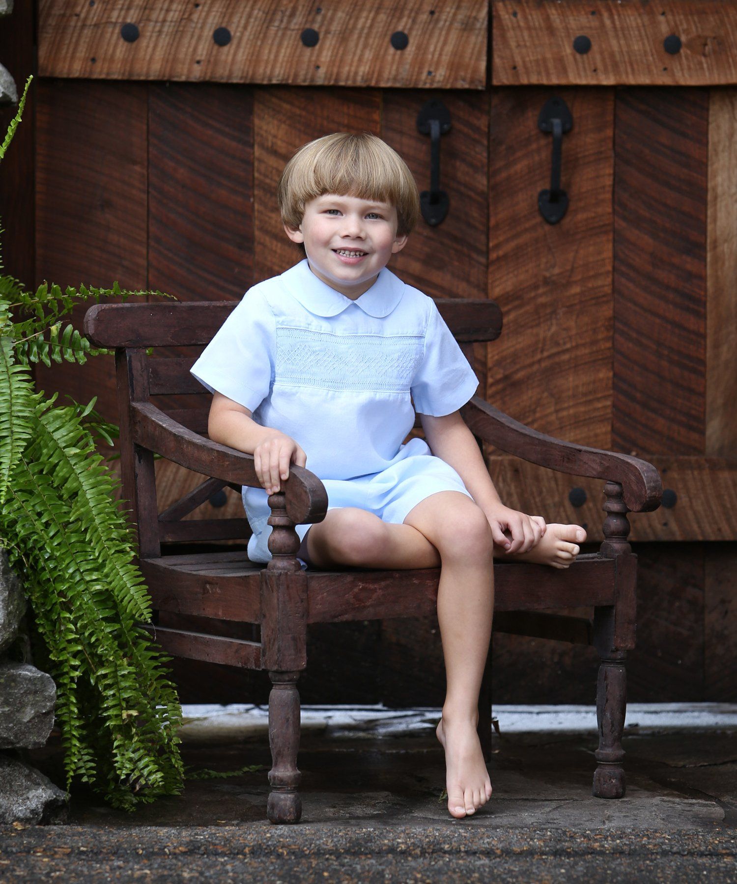 Portrait of boy sitting on bench Nashville