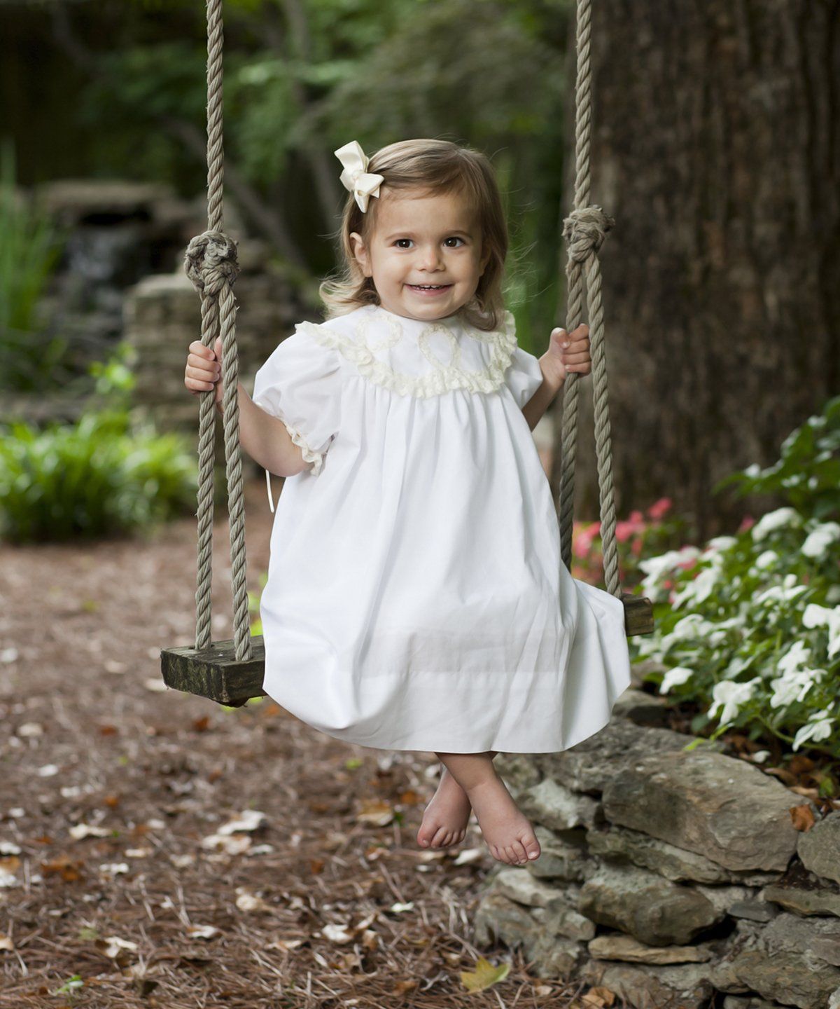 Outdoor portrait of child swinging in Nashville
