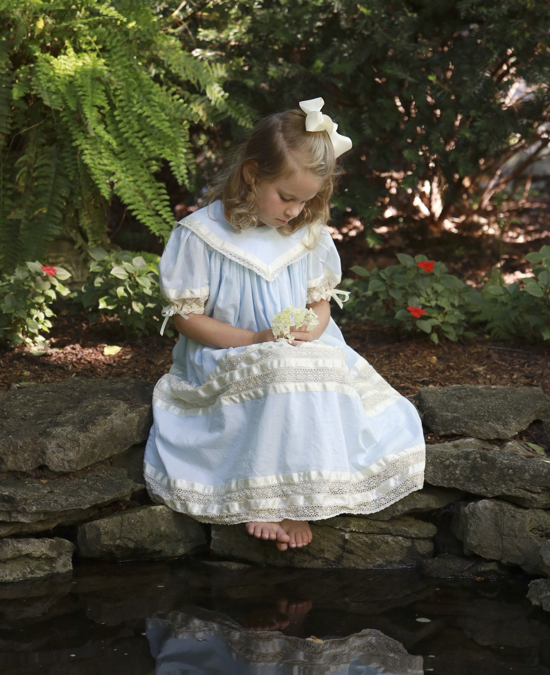 Outdoor photo of child playing in creek