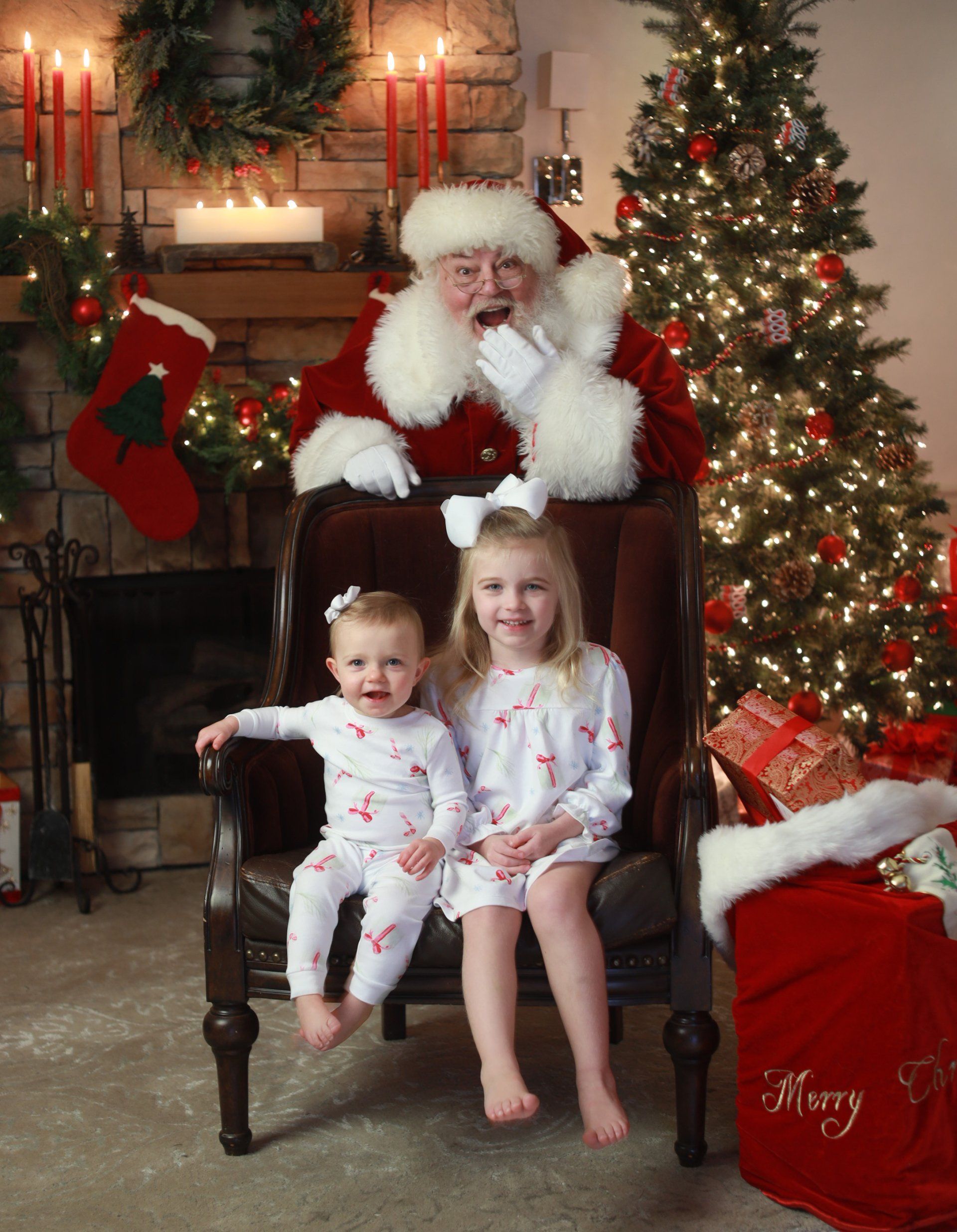 Children sitting with Santa laughing