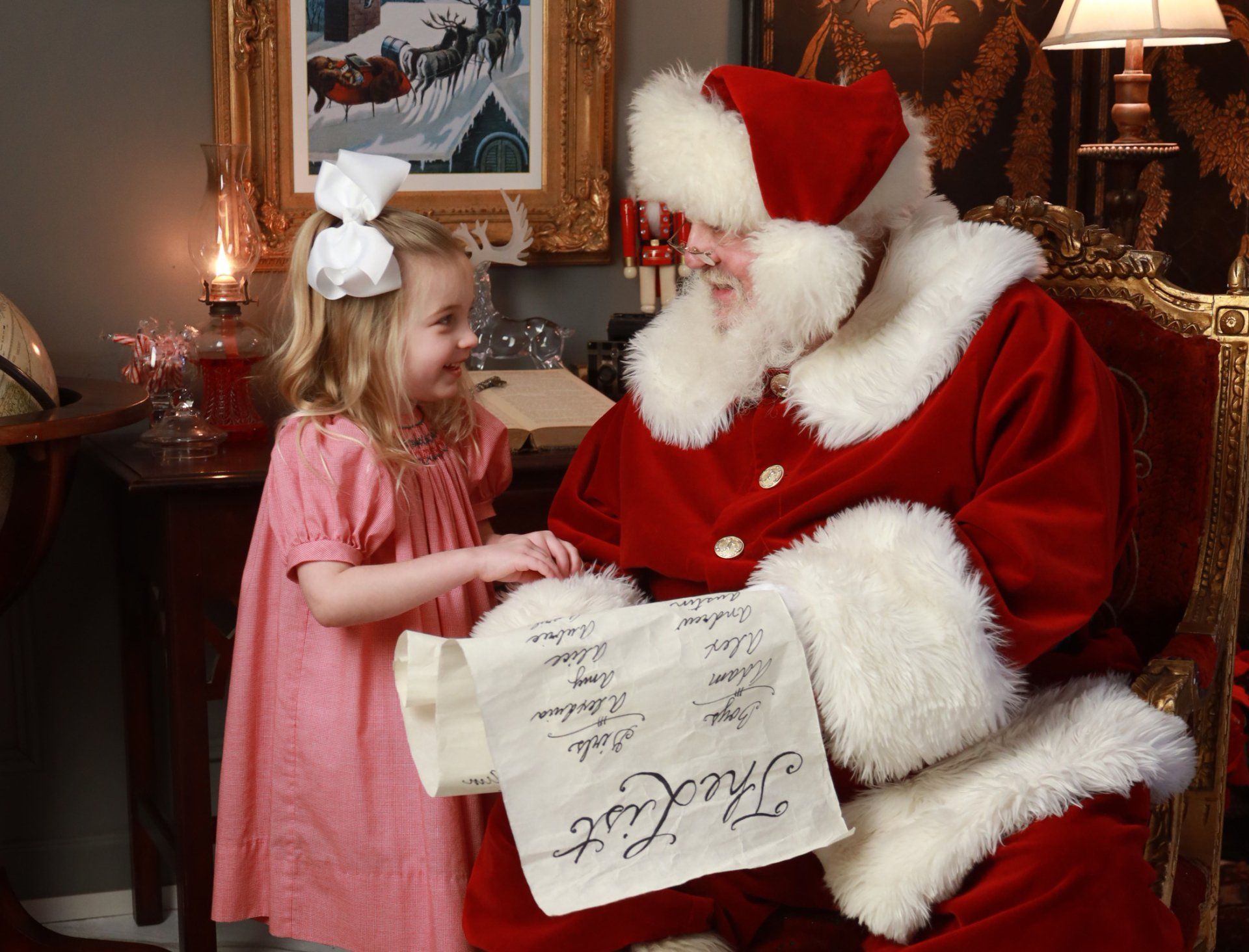 Santa and girl going through the list
