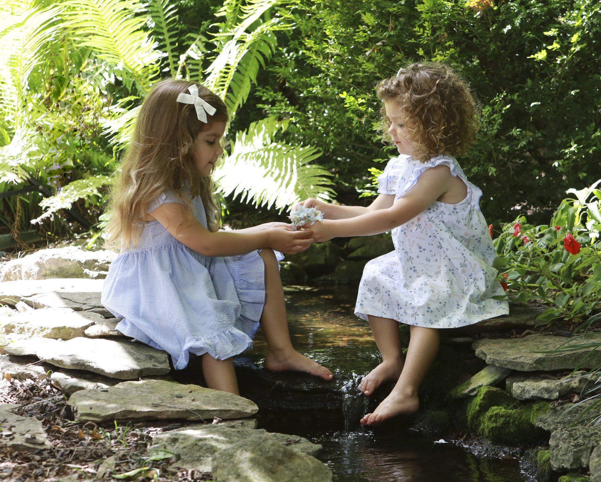Outdoor portrait of sisters playing