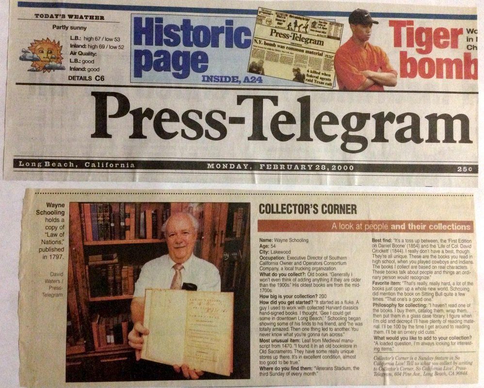 A man is holding a piece of paper in front of a newspaper that says press-telegram