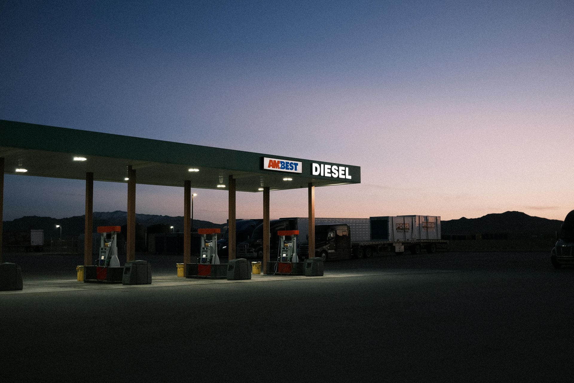 A diesel gas station is lit up at night