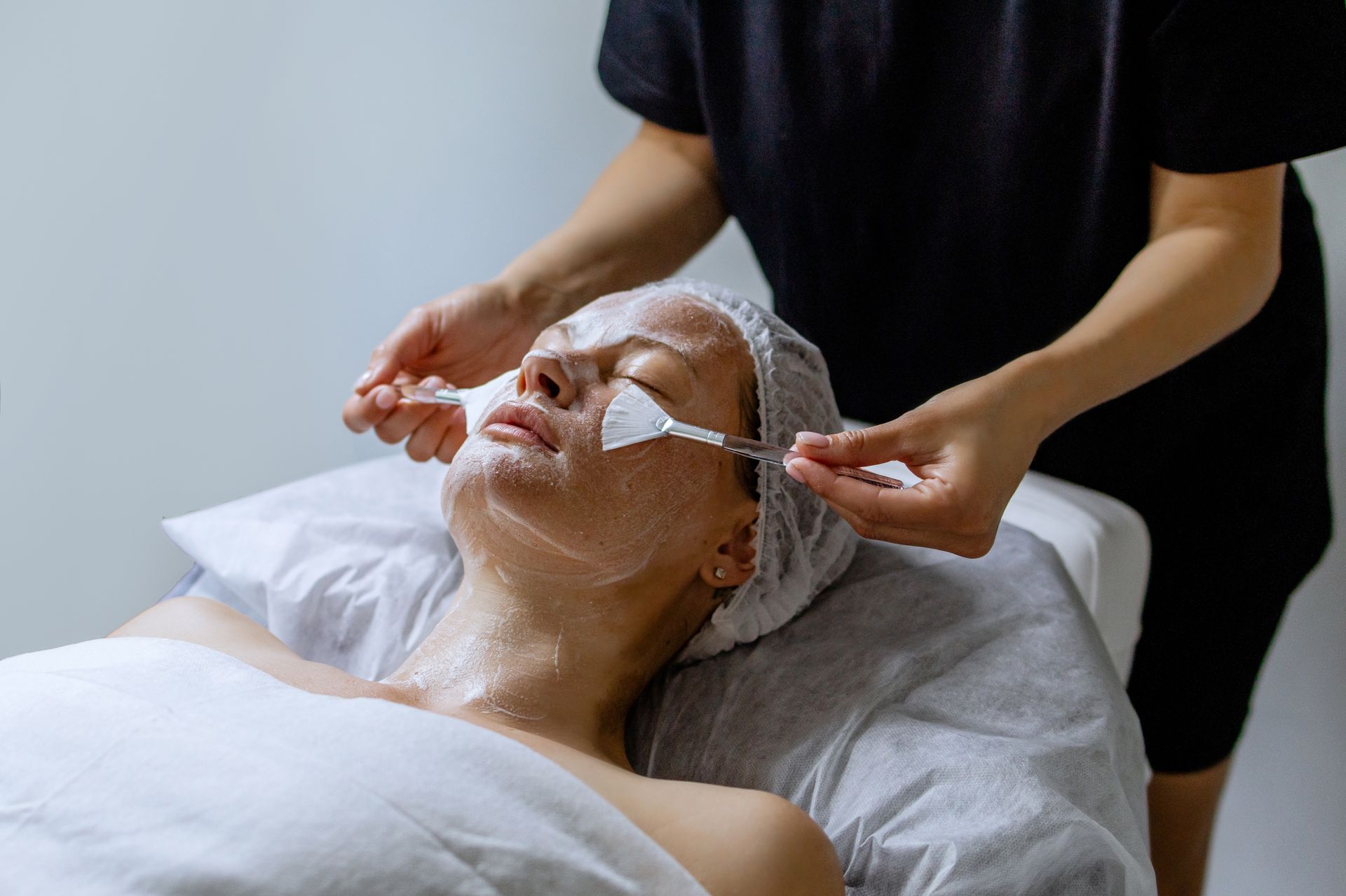 Person Receiving Facial Treatment, Covered in Cream — Aspire Beauty & Nails in Wagga Wagga, NSW