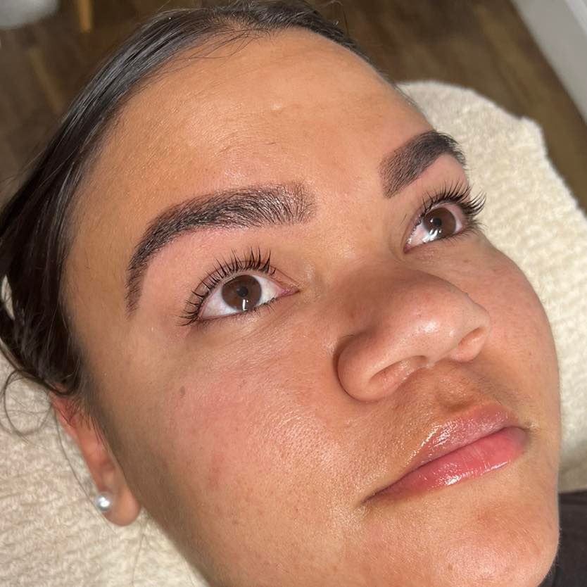 Woman with Dark Eyebrows and Lashes Gazing Upwards — Aspire Beauty & Nails in Wagga Wagga, NSW
