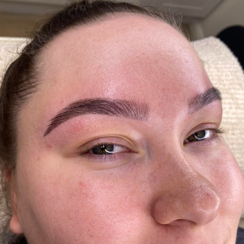 Woman With Newly Tattooed Dark Brown Eyebrows — Aspire Beauty & Nails in Wagga Wagga, NSW