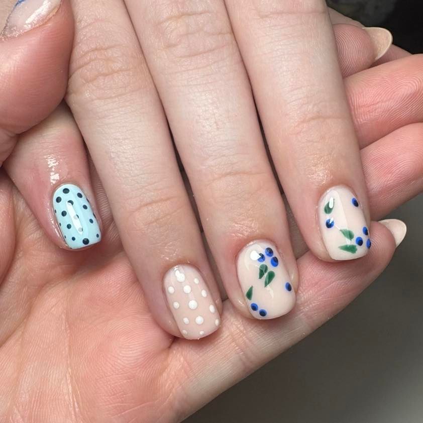 Hand With Short Nails Painted With Light Blue Polka Dots — Aspire Beauty & Nails in Wagga Wagga, NSW