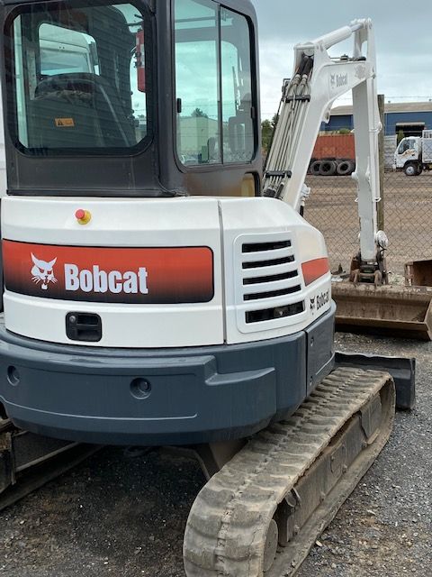 A Bobcat Excavator Is Parked In A Gravel Lot — Hervey Bay Mini Excavations In Dundowran, QLD