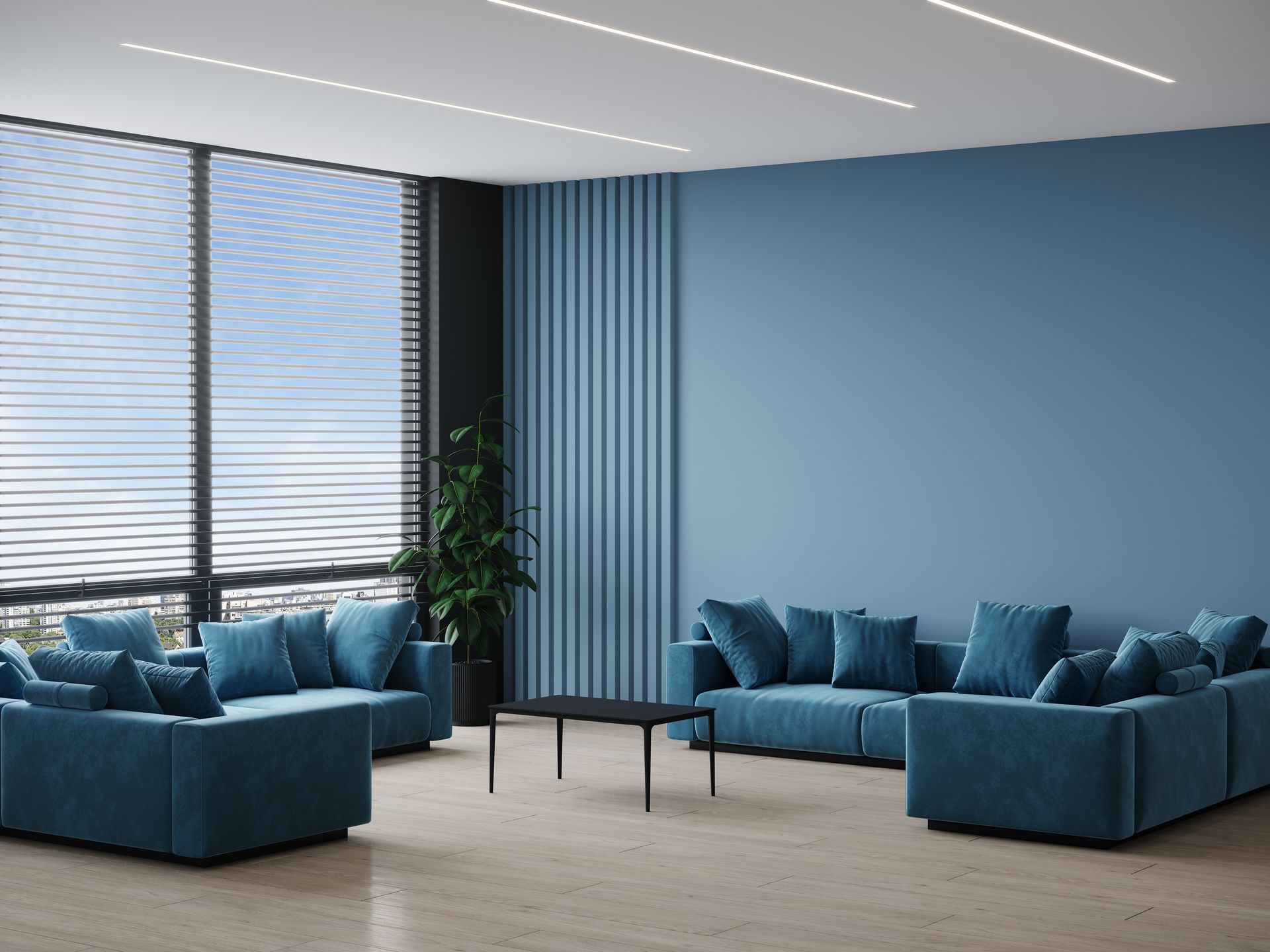 Modern lounge with blue sofas, low black table, large windows, and sheer blinds in a bright office space