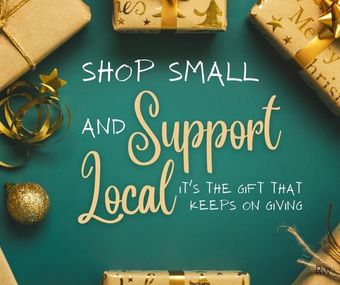 A sign that says shop small and support local it 's the gift that keeps on giving