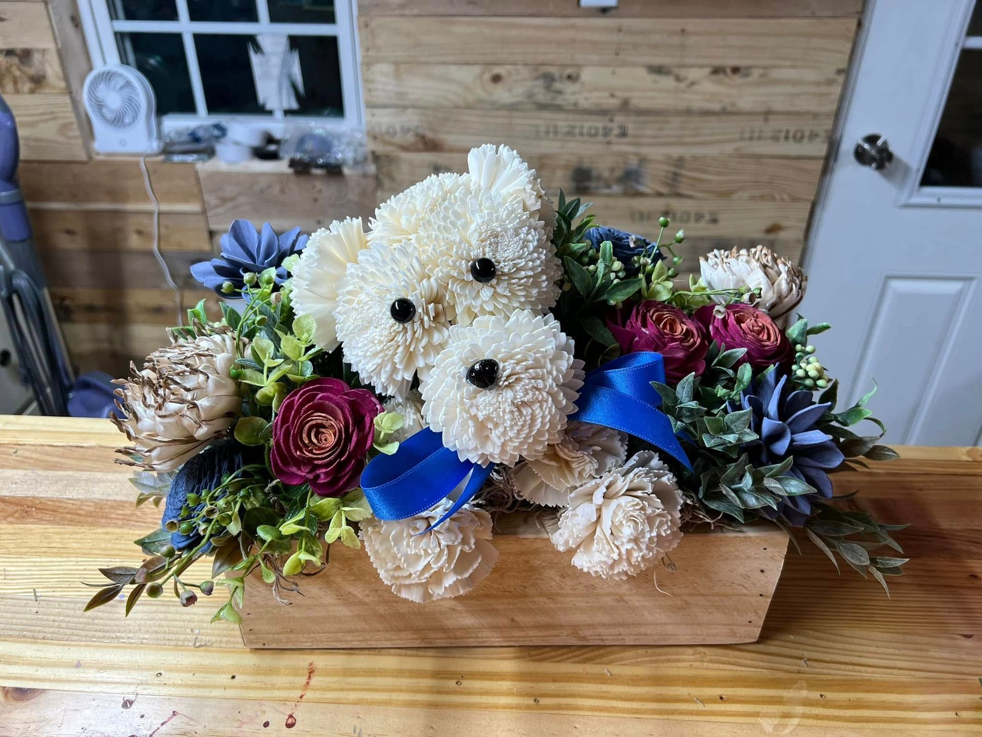 bride standing surrounded by green trees