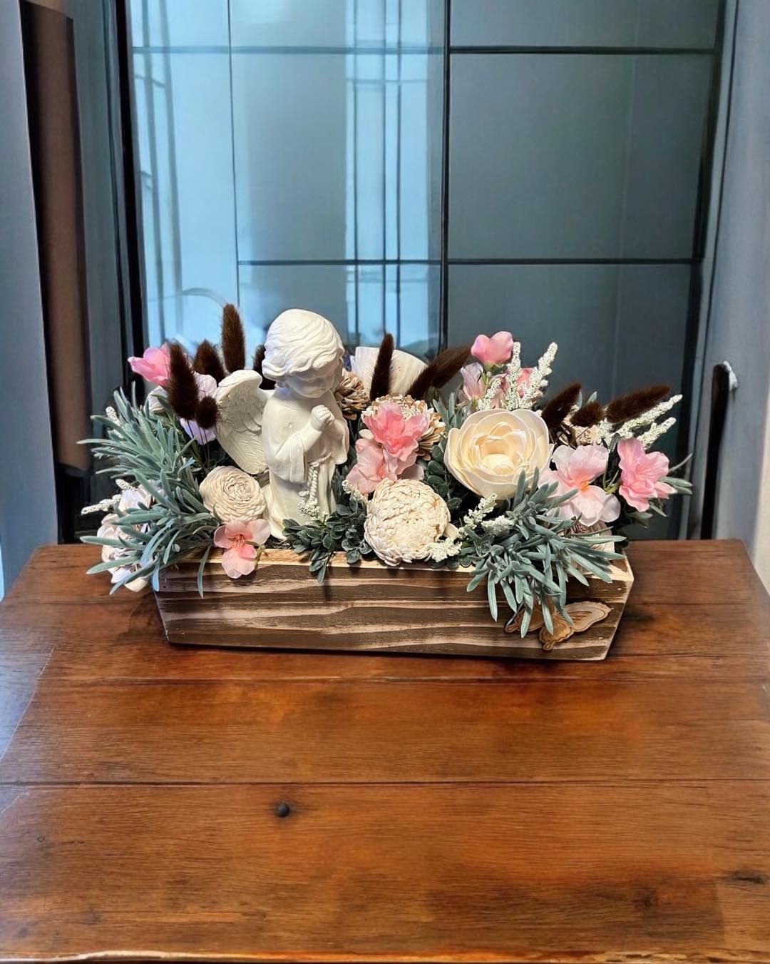 white and pink wooden floral arrangement