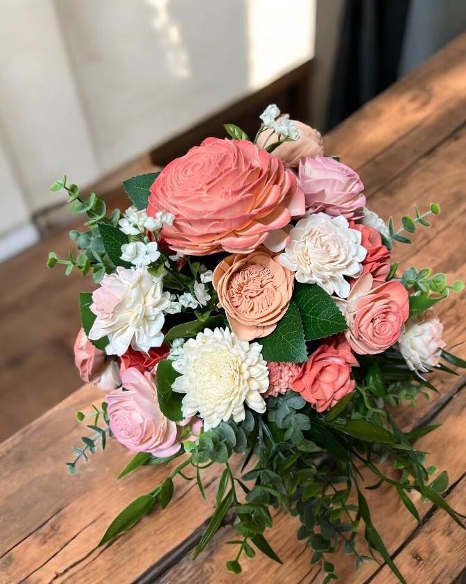 peach and pink wooden flower ararngement