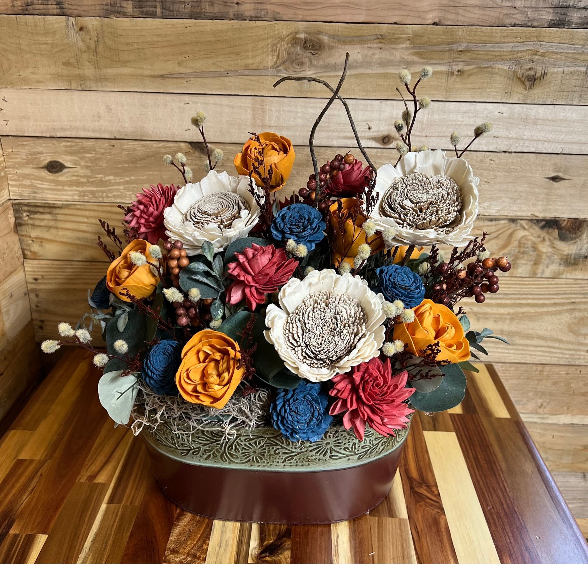 fall toned wooden flower arrangement