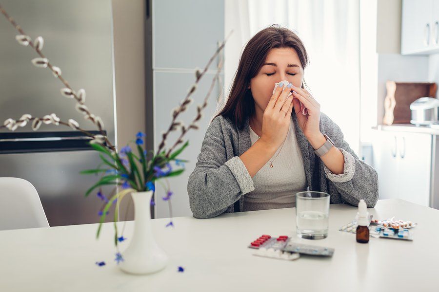 Woman with allergies poor ventilation and HVAC